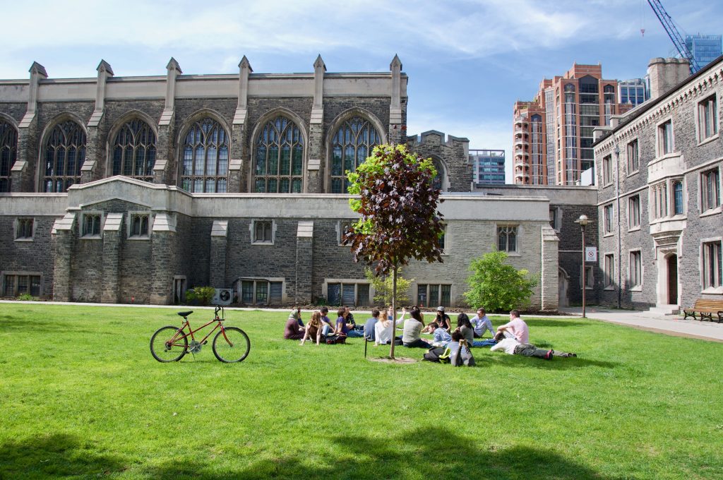 Students gather on the lawn outside Burwash Hall. 