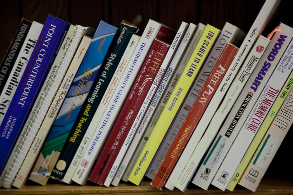 A row of books about study skills line a bookshelf. 