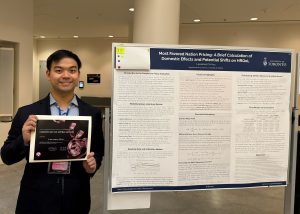 Picture or Economics PhD student Lawrence Hsu and his research poster at the BTBA Conference