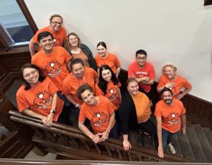 Professor Robert Gillezeau joins Department of Economics Staff for an Orange Shirt Day photo on the Max Gluskin House stairs. 